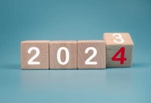 four wooden blocks with 2024 on them