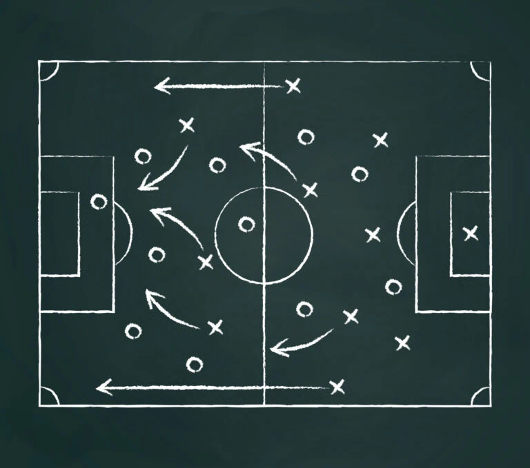 a dark chalk board with a game plan written in chalk