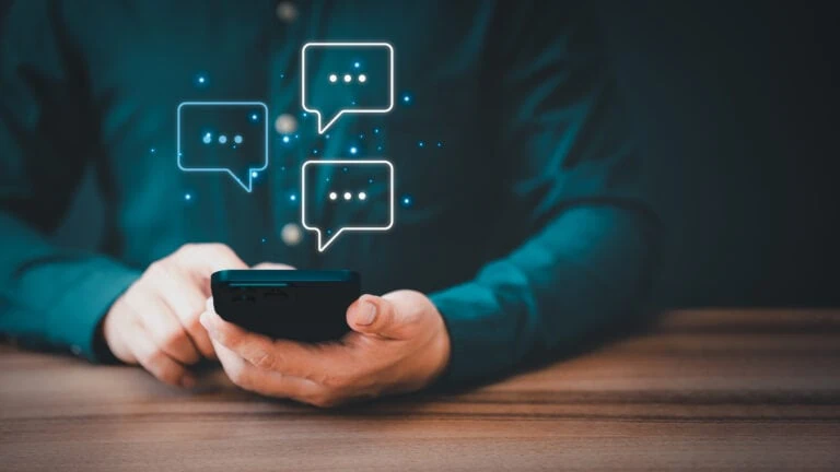 Man hand using smartphone typing live chat chatting on application communication digital web and social network concept. Social media application chat box.